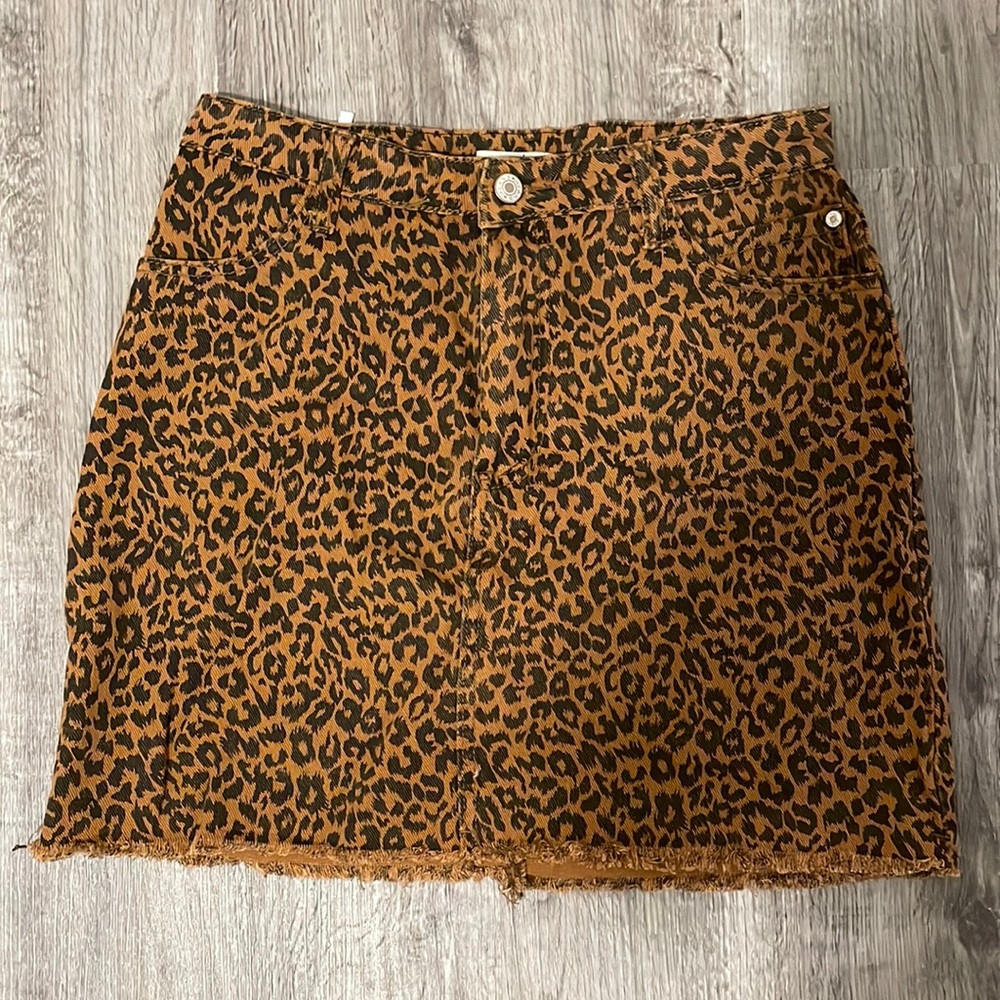 LUC-CE Animal Print denim mini skirt. NWT. Size Large.